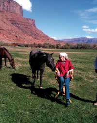 Photo of Bette Stanton with horses